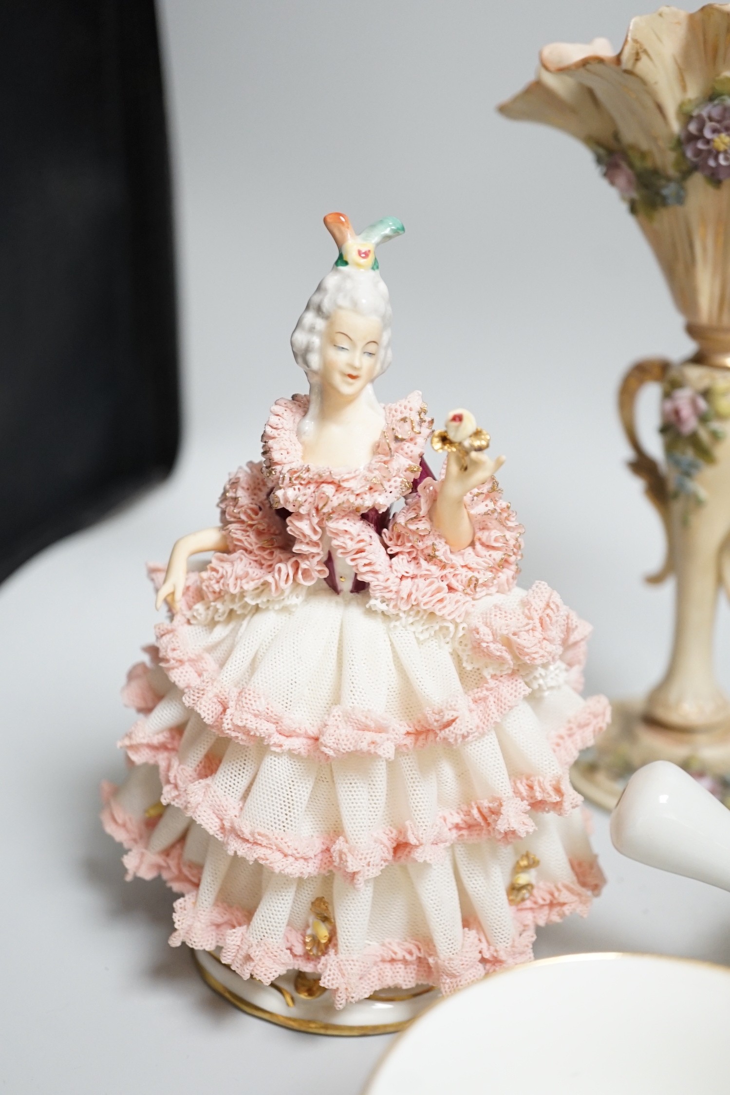 Continental porcelain figures, a Lalique figure of a crouched figure, etc.